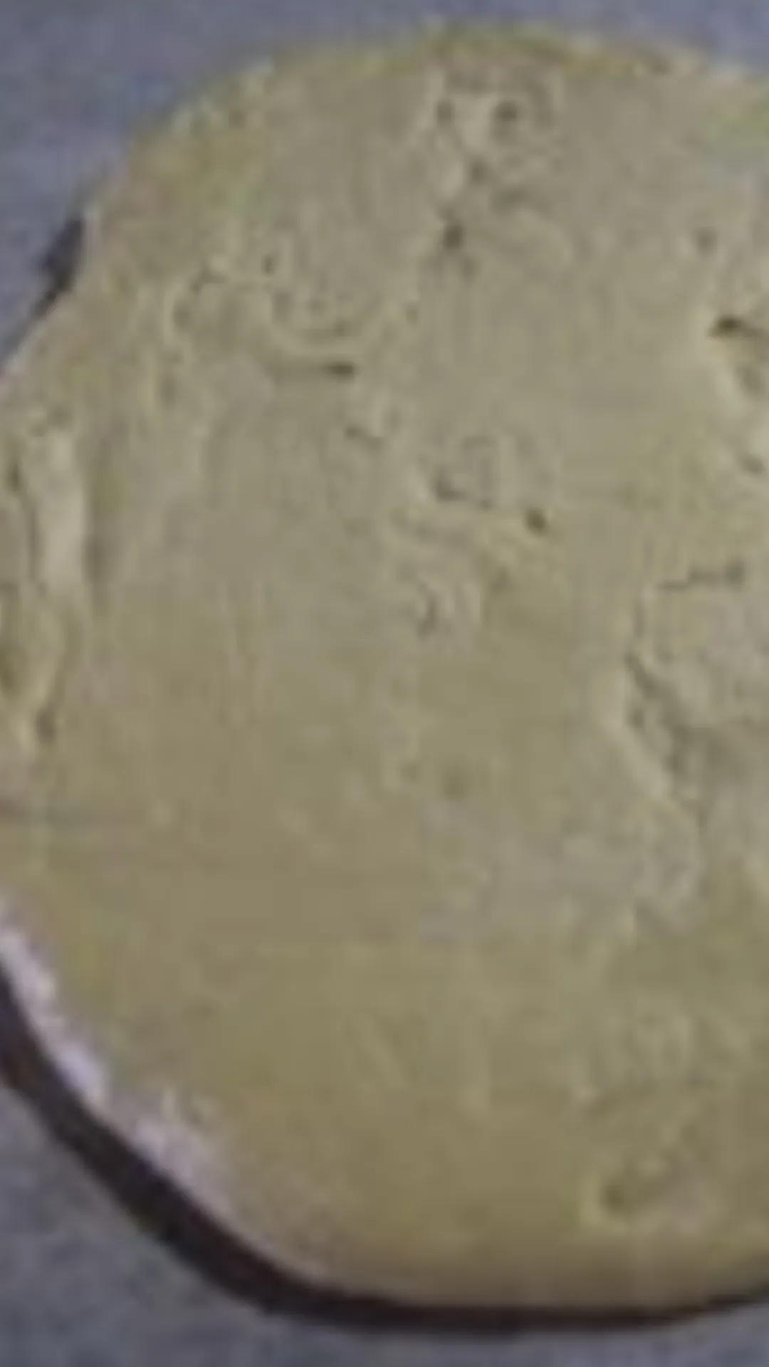 Stir until the mixture turns into a smooth paste. Turn off the flame and continue to stir until the mixture turns into a dough.
