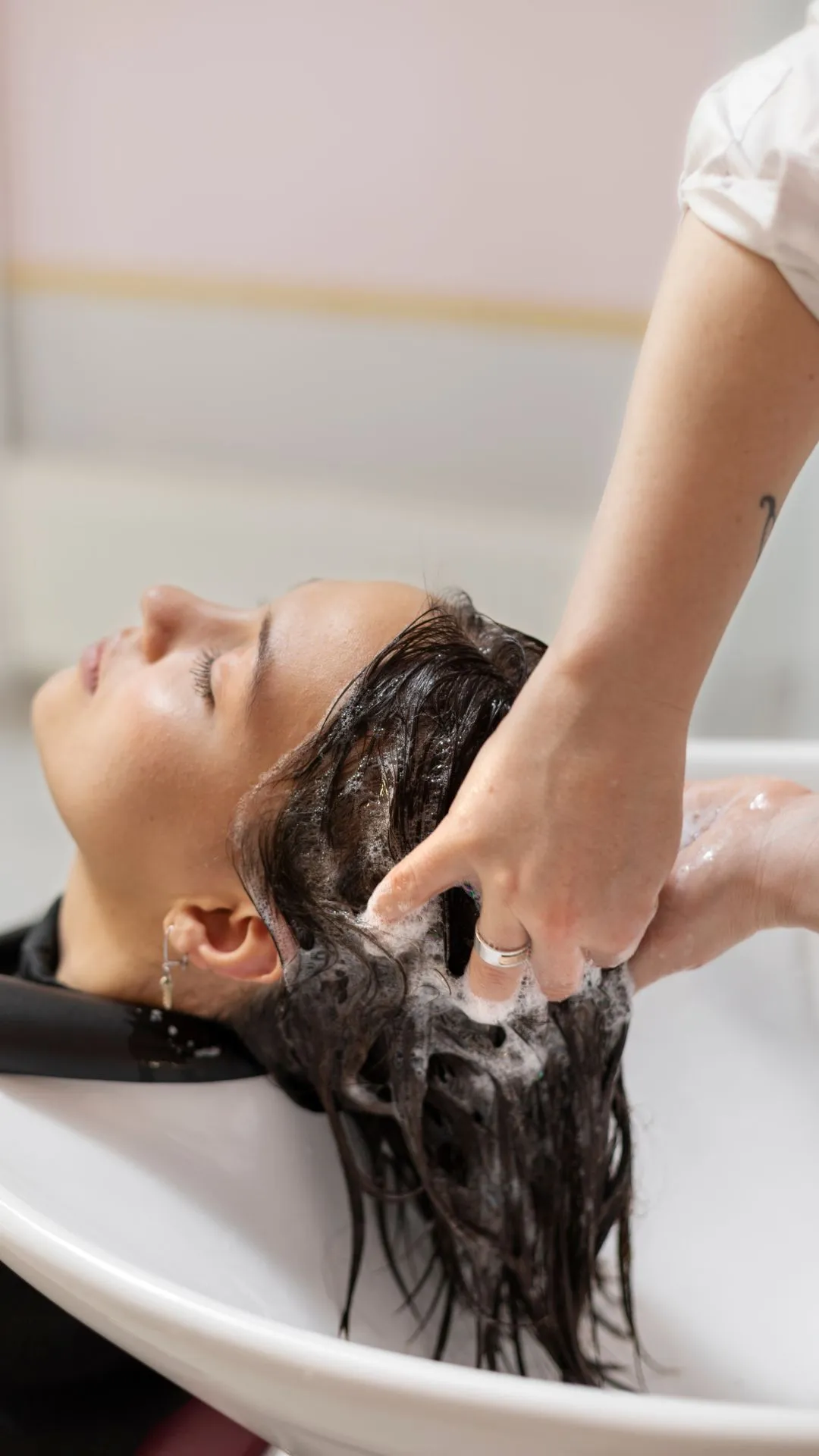 1. Washing your hair too often: It feels clean in the moment, but frequent washing slowly strips away natural oils. Hair starts feeling dry, then oddly greasy again, and the cycle keeps repeating without you realising it.