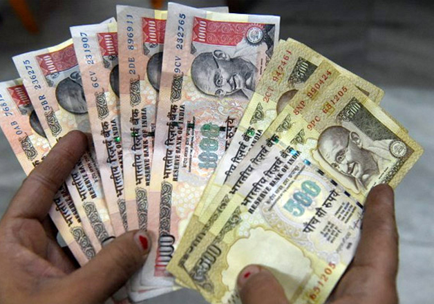 File pic - Rs 500 and Rs 1,000 notes on display 