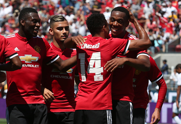 Anthony Martial celebrates with Jesse Lingard after assisting a tap in. 