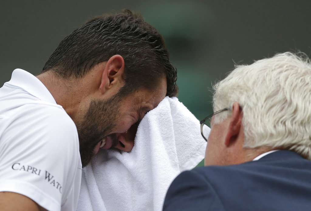 Marin Cilic has treatment on his foot as he takes a medical timeout