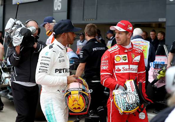 Mercedes' Lewis Hamilton with Ferrari's Sebastian Vettel at the Britain GP F1 Britain GP