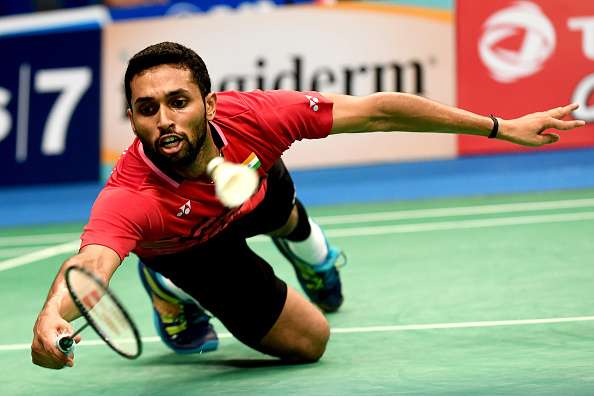 Prannoy H.S. of India returns a shot against Zhen Long of China
