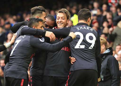 Mesut Ozil after celebrates scoring his side's second goal against Everton during the English Premier League match