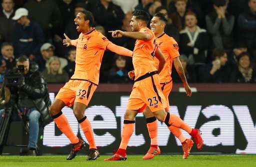 Joel Matip celebrates scoring his sides second goal during the EPL match between West Ham and Liverpool