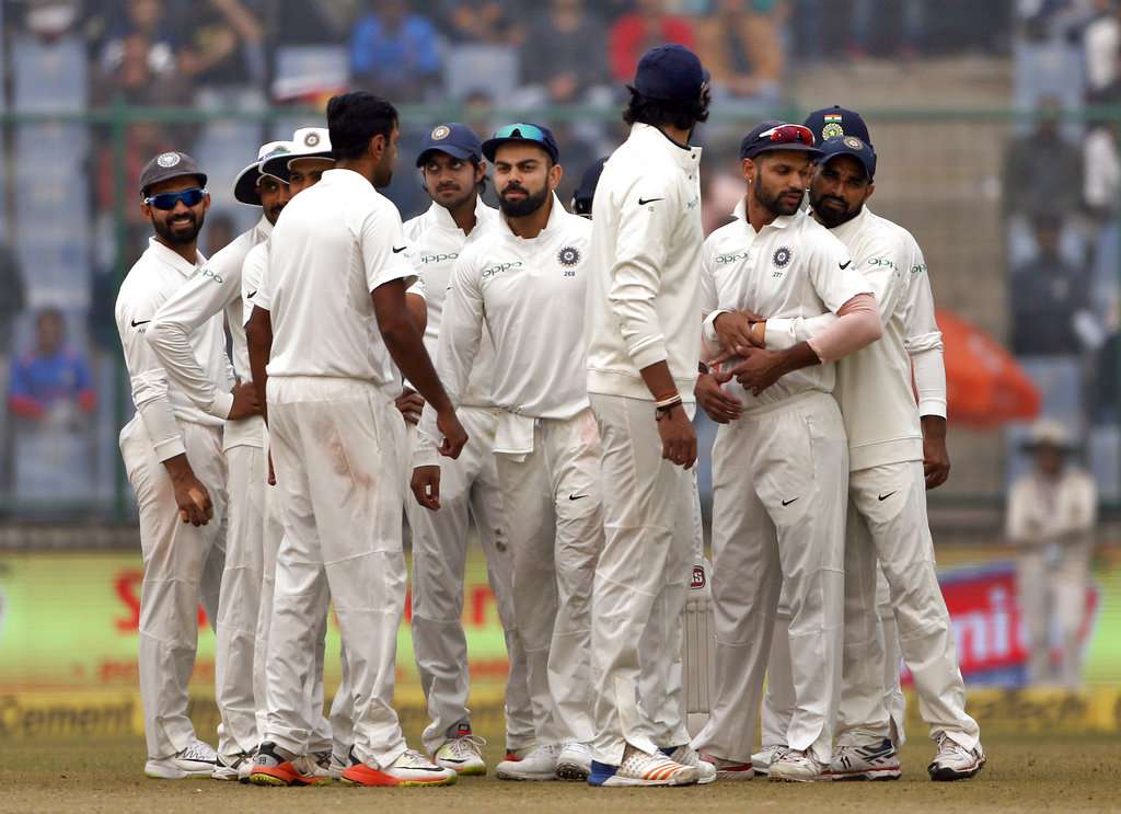 Indian players celebrate after a dismissal.