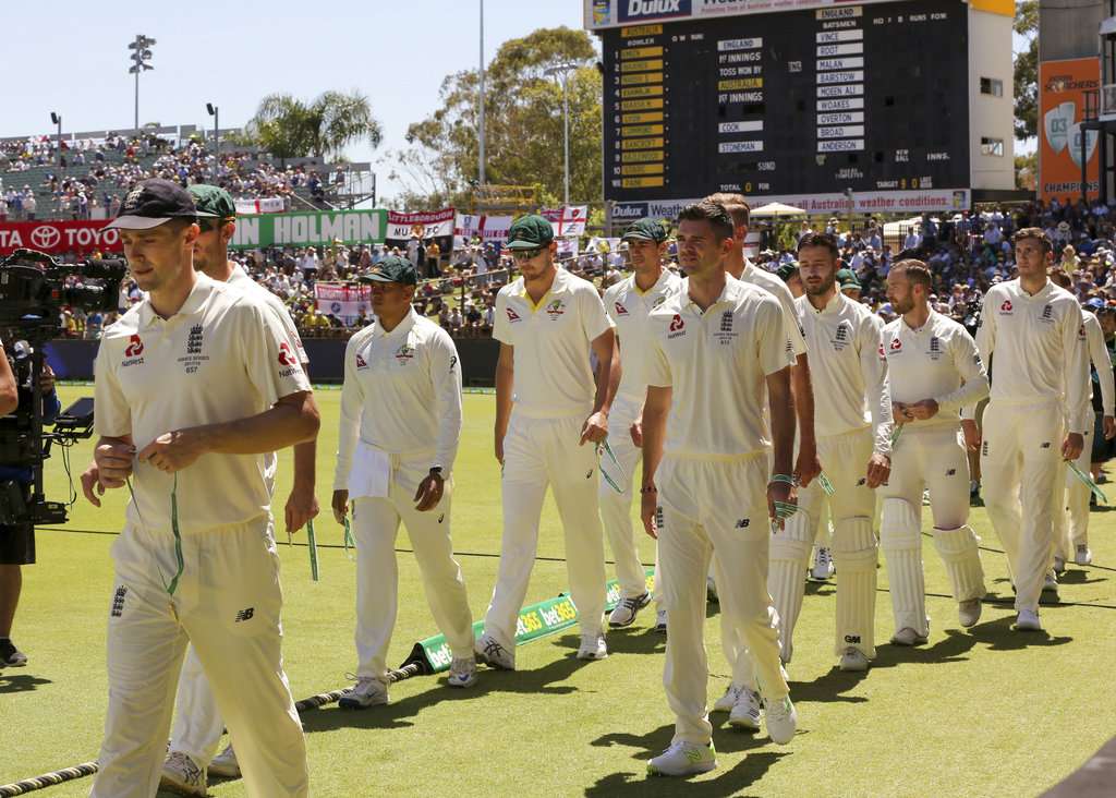 England's and Australia's players take the field before the third Ashes Test match in Perth