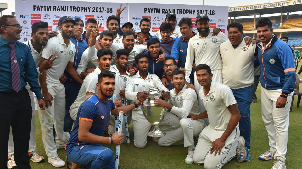 Vidarbha players celebrate with the trophy after winning the Ranji Trophy final against Delhi in Indore on Monday.