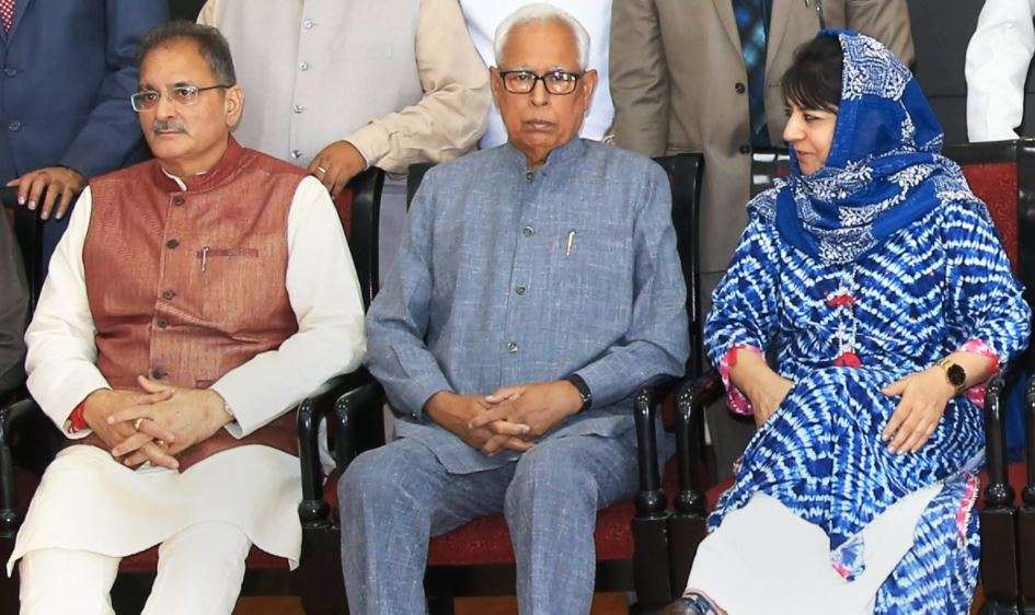Jammu: Jammu &amp; Kashmir Governor NN Vohra, Chief Minister Mehbooba Mufti and Dy Chief Minister Kavinder Gupta at the swearing-in ceremony after the cabinet reshuffle, in Jammu on Monday.&nbsp;