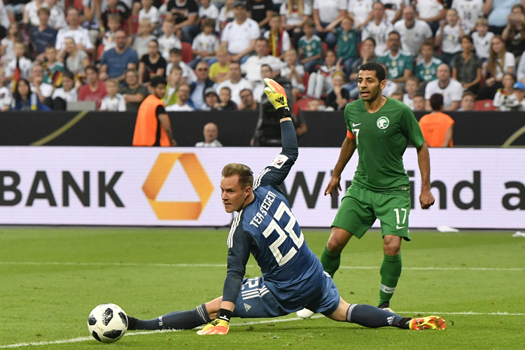 Marc-Andre ter Stegen makes a save in front of Saudi Arabia's Taisir Al-Jassim
&nbsp;
