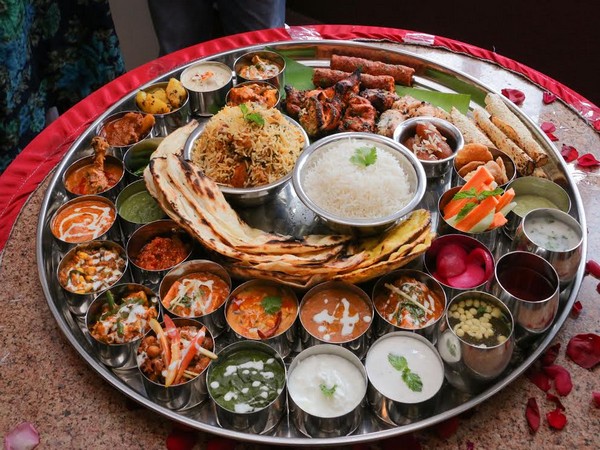 Treat your taste buds with a thali which offers more than 30 dishes ...