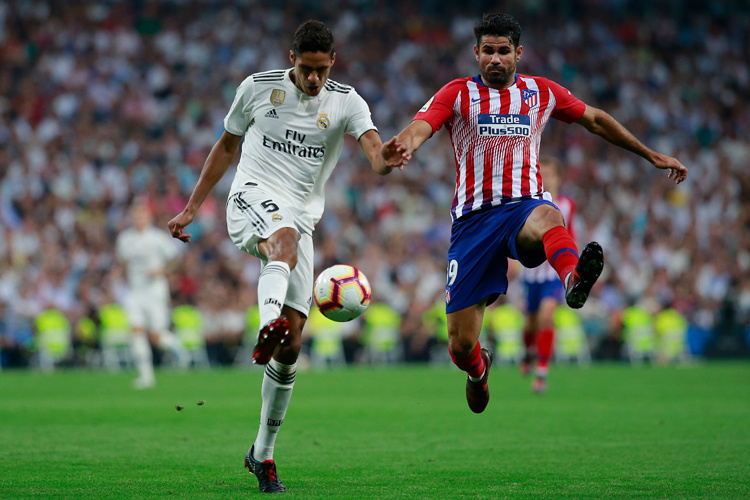 Raphael Varane(left) of Real Madrid and Diego Costa(right) of Atletico Madrid in action during the derby clash.