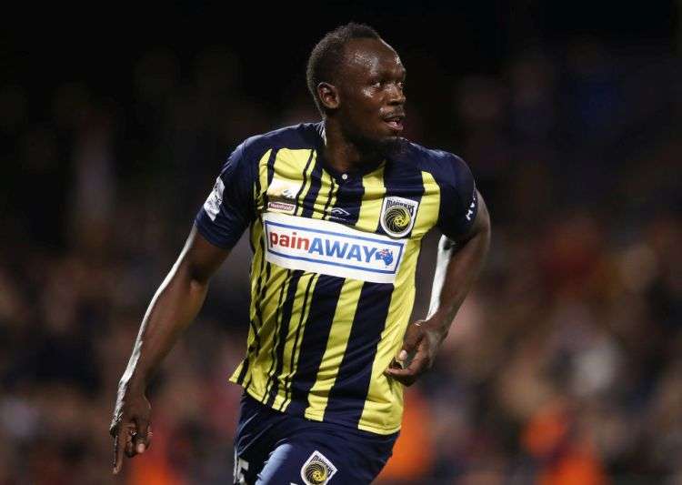 Usain Bolt in action during the football match
