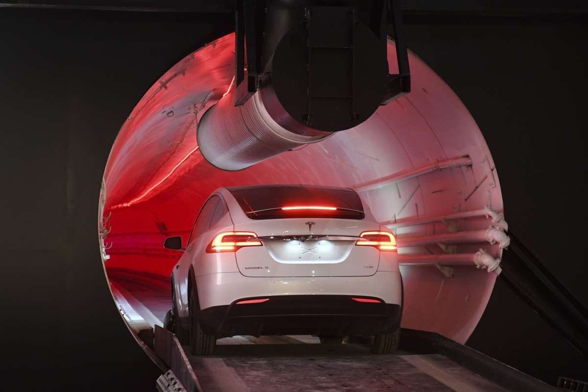 Elon Musk unveils underground tunnel, offers rides to VIPs