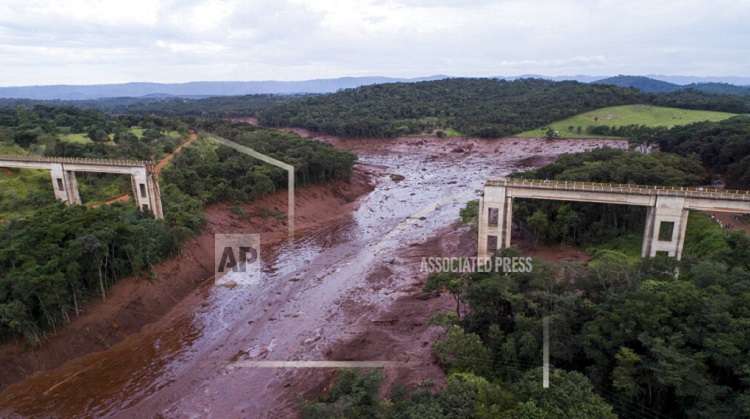 Brazil dam collapse: 9 dead, search continues for 300 others buried under mud