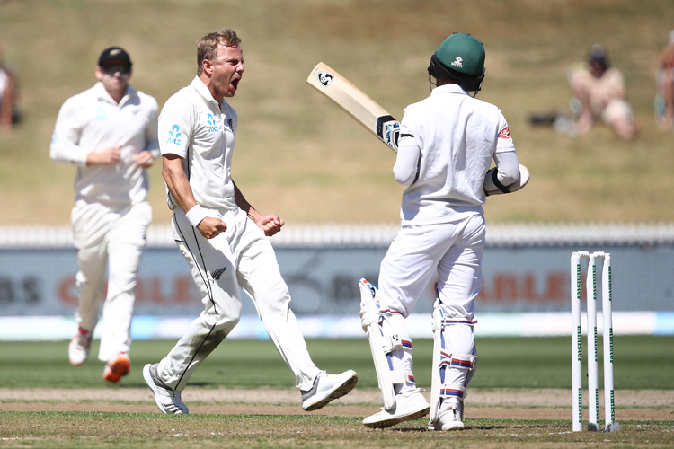 Neil Wagner of New Zealand celebrates his wicket of Mominul Haque of Bangladesh.