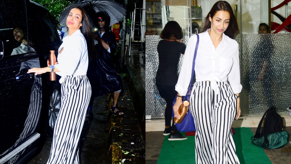 Malaika Arora's fashion game seems on point as she was spotted in white shirt and striped pants