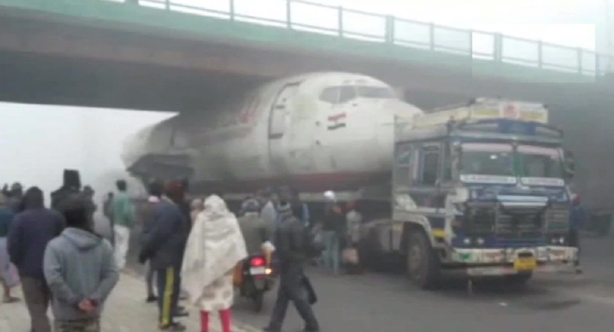 Video Truck carrying plane gets stuck under a bridge in West Bengal's