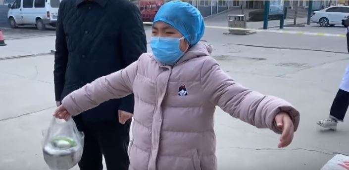 Nurse in China treating coronavirus patients gives daughter 'air hug'. Emotional video goes viral