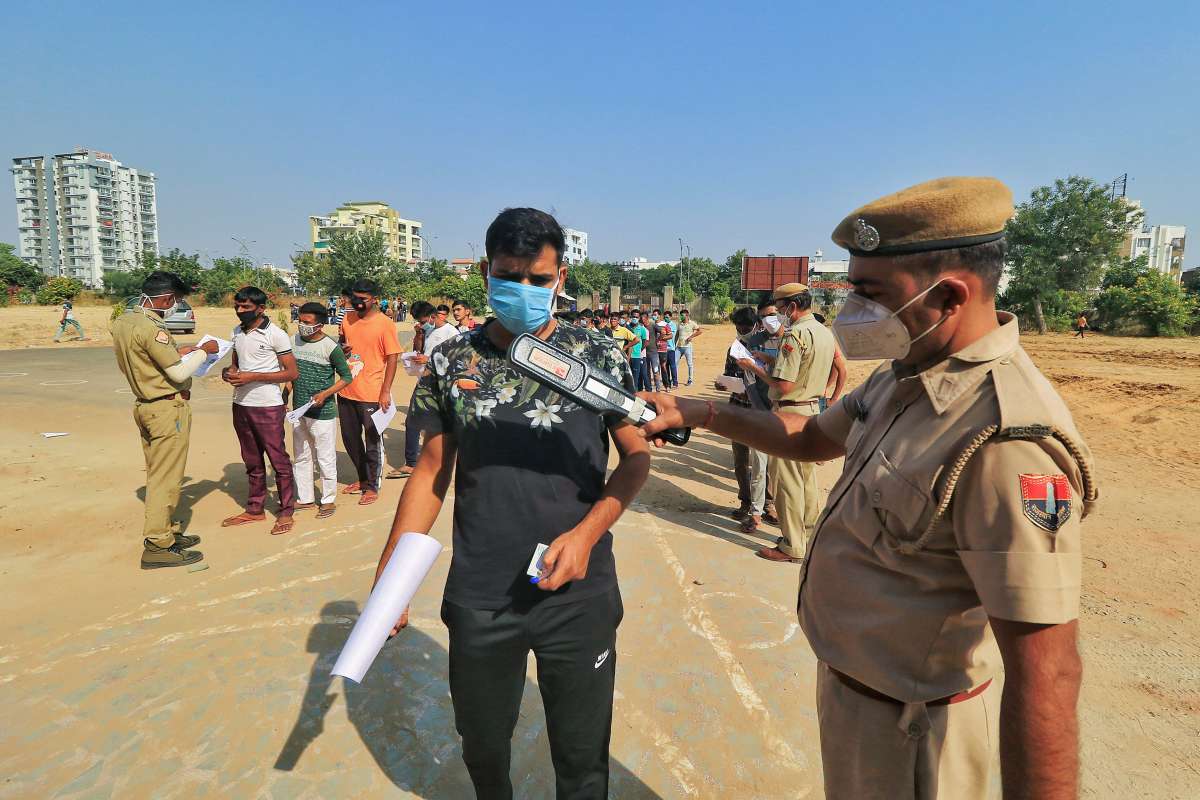 Jaipur: Candidates being screened as they arrive at an examination centre to appear for the Rajasthan Police Constable Exam. 