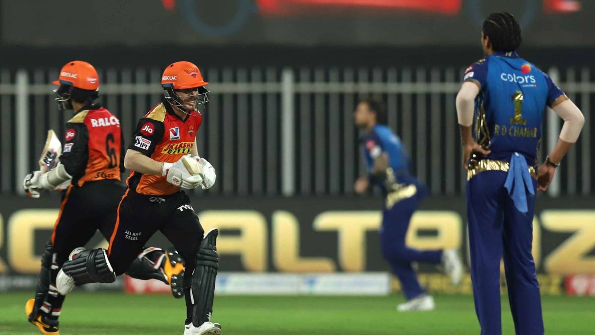 SRH skipper David Warner (centre) and Wriddhiman Saha runs between the wicket on Tuesday.
