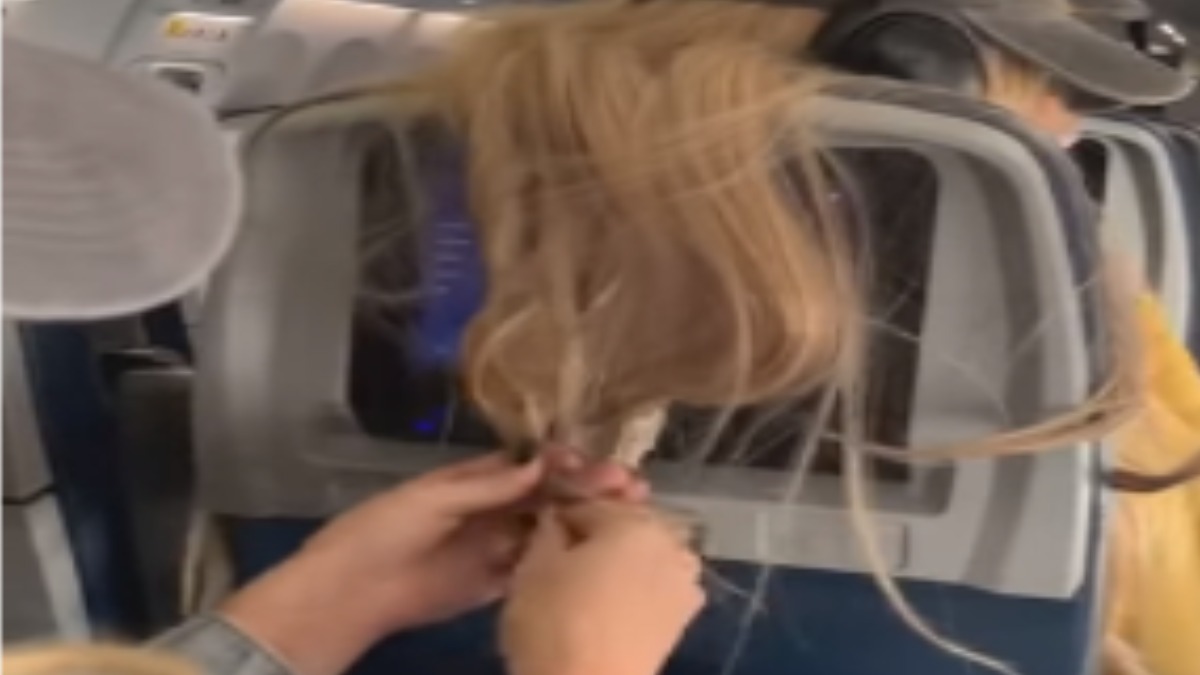VIDEO: Woman sticks chewing gum, lollipop on passenger's hair mid flight;  see how Netizens reacted | Trending News – India TV
