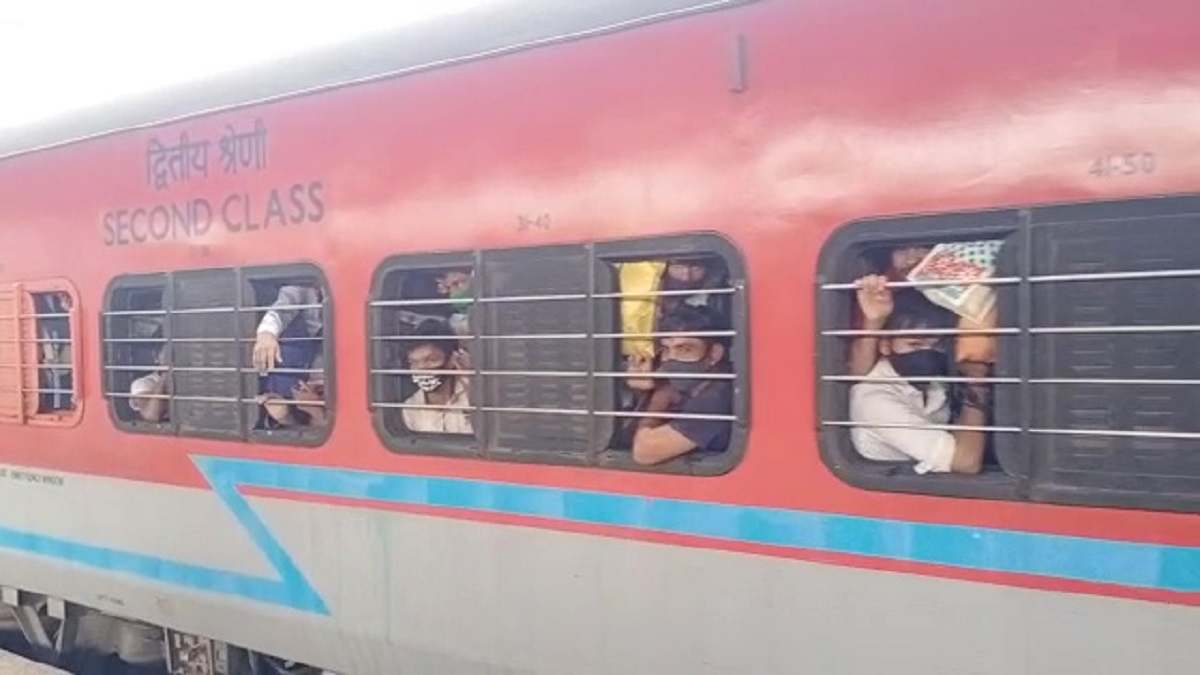 Migrant workers returning home from Mumbai in packed trains due to Covid-19 restrictions