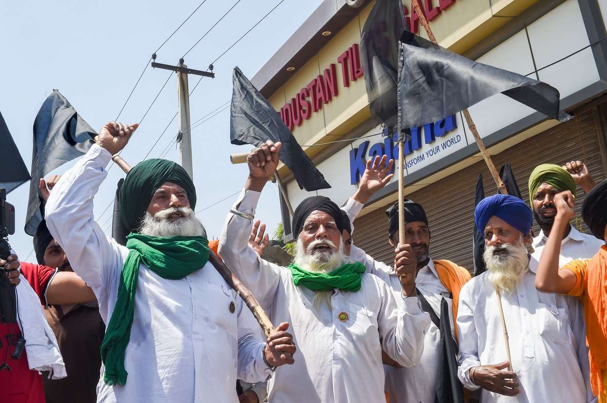Farmers burnt copies of the Centre's three farm laws near residences of BJP leaders and at other places in Punjab Farmer agitation