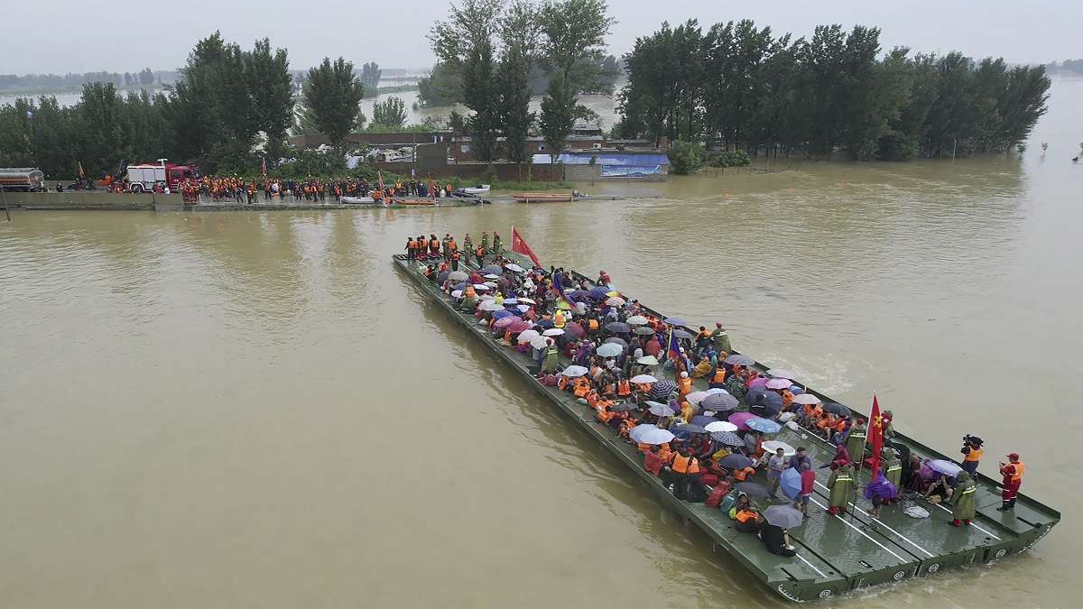 Death toll in central China floods rises to 56, losses mount to USD 10 billion