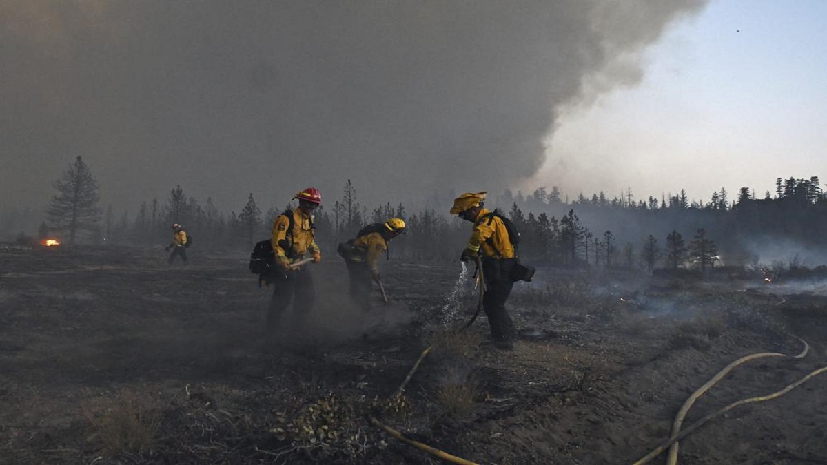 California firefighters battle big wildfires in high heat