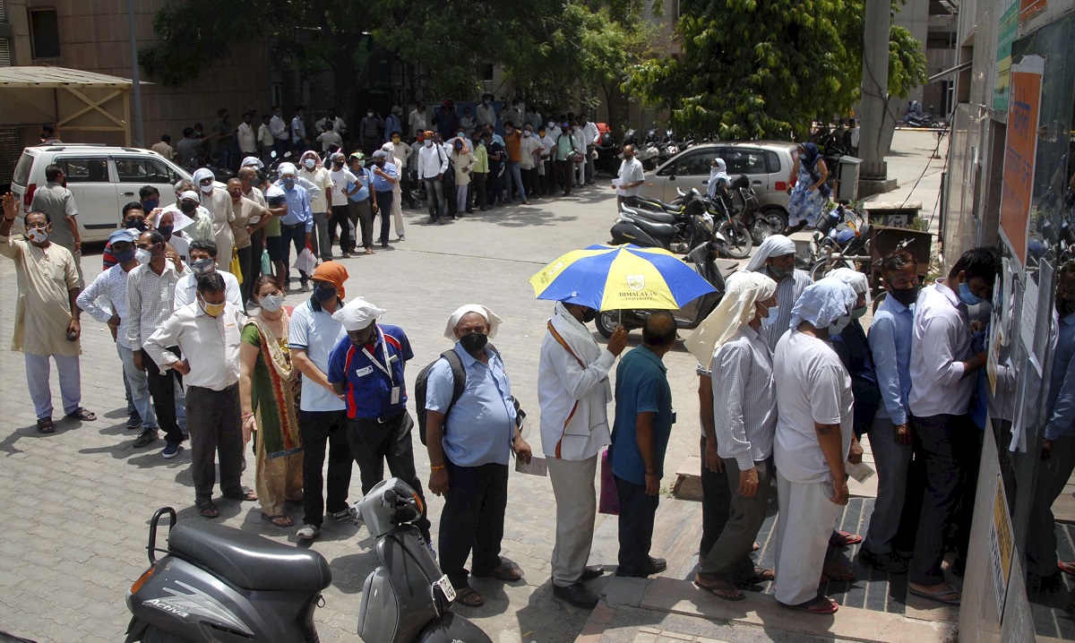 Noida: Beneficiaries wait in a long queue to receive COVID-19 vaccine dose at a disrict hospital in Noida