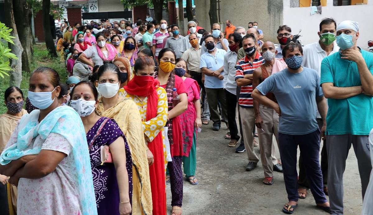 Jammu: People wait to receive a dose of COVID-19 vaccine at a vaccination centre