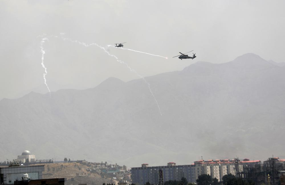 Anti-missile decoy flares are deployed as U.S. Black Hawk military helicopters fly over the city of Kabul, Afghanistan, Sunday, Aug. 15, 2021. Taliban fighters entered the outskirts of the Afghan capital on Sunday and said they were awaiting a &ldquo;peaceful transfer&rdquo; of the city after promising not to take it by force, but amid the uncertainty panicked workers fled government offices and helicopters landed at the U.S. Embassy.&nbsp;
&nbsp;