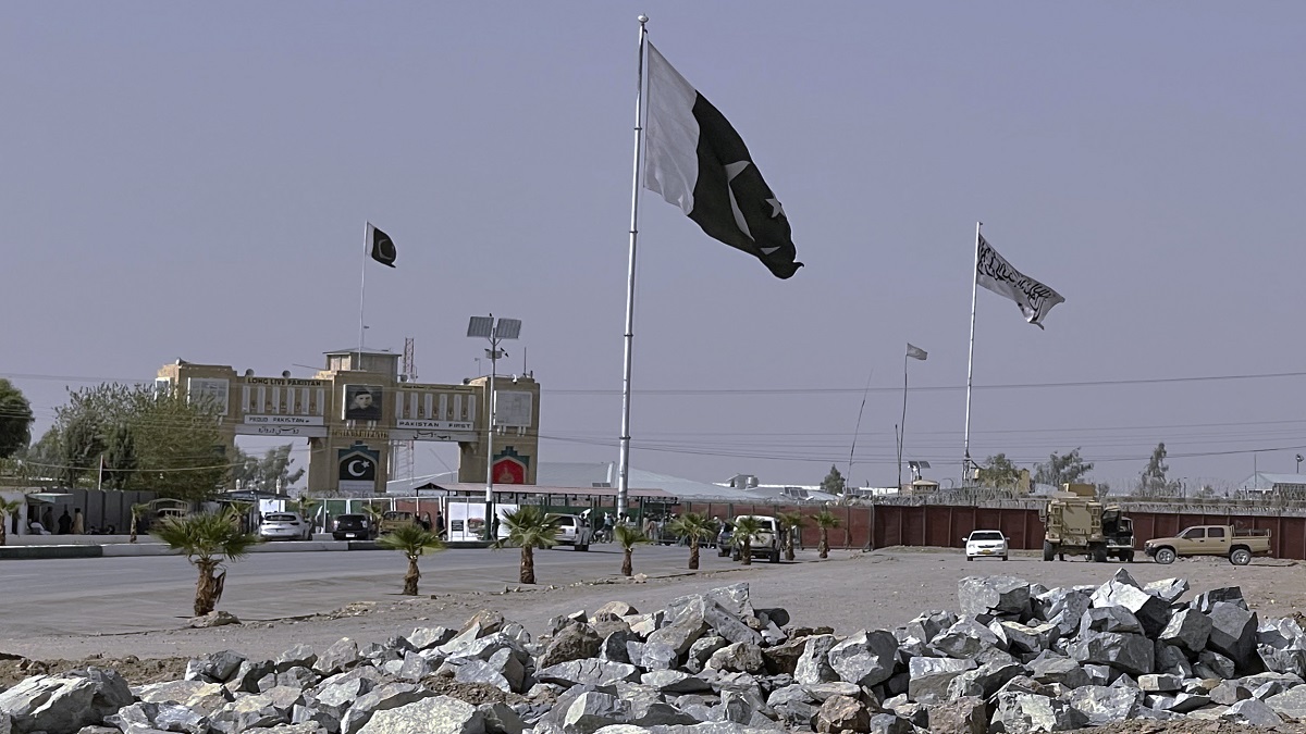 Pakistan and Taliban flags are seen on their respective sides near Friendship gate at a border crossing point in Chaman.