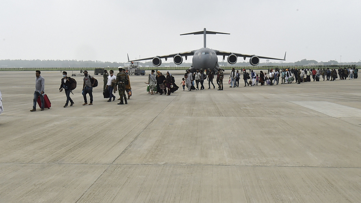 People who were stranded in crisis-hit Afghanistan arrive by a special repatriation flight of IAF at the Hindan Air Force Station in Ghaziabad on August 22.
