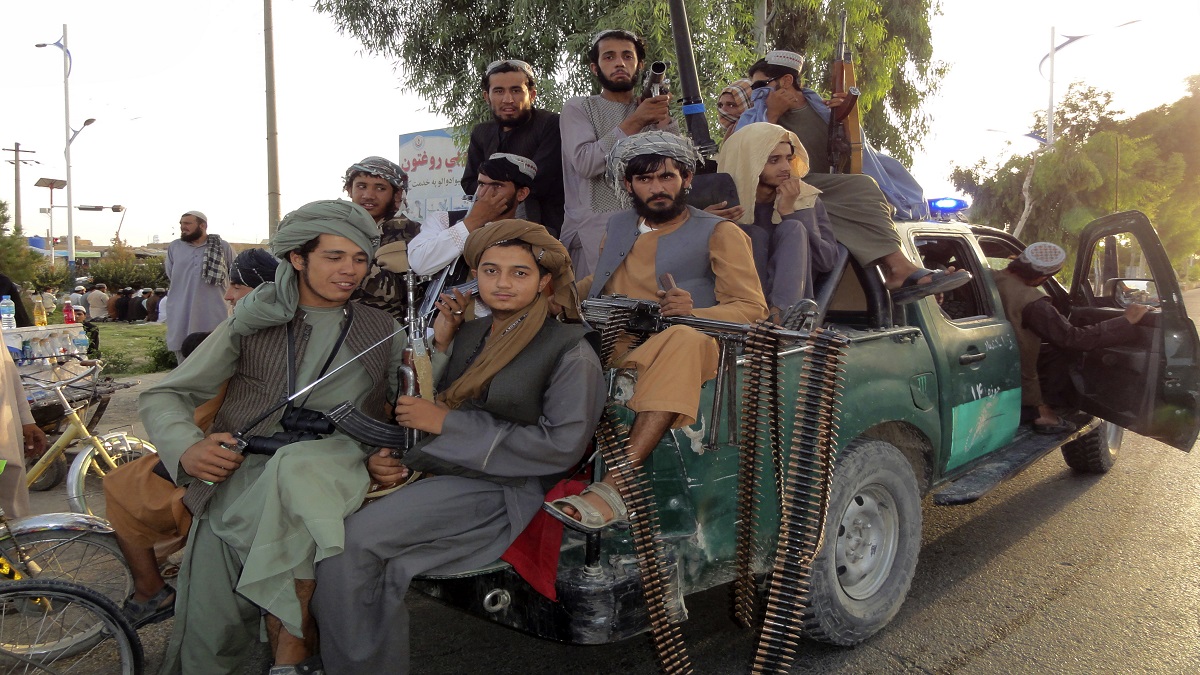 Taliban fighters patrol inside the city of Kandahar province southwest, of Afghanistan, Sunday.