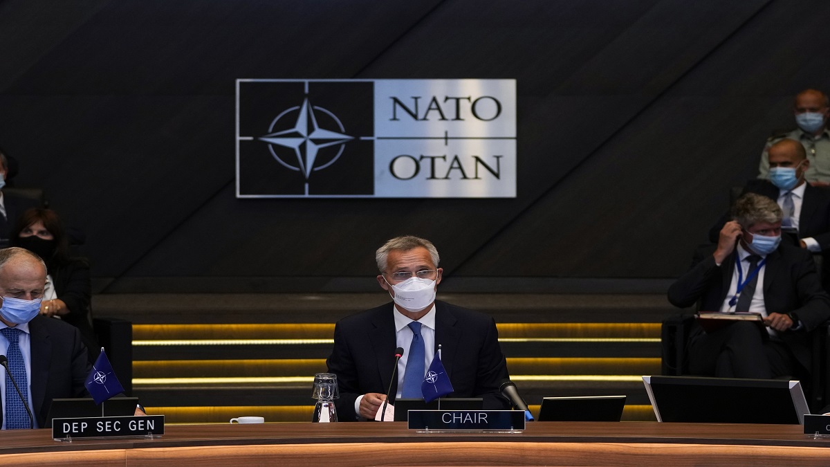 NATO Secretary-General Jens Stoltenberg, center, speaks during a NATO Foreign Ministers video meeting following developments in Afghanistan at the NATO headquarters in Brussels