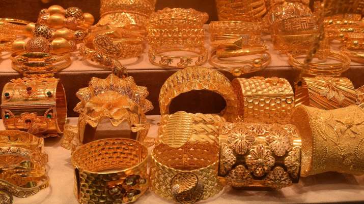 Gold rises Rs 128; silver marginally up