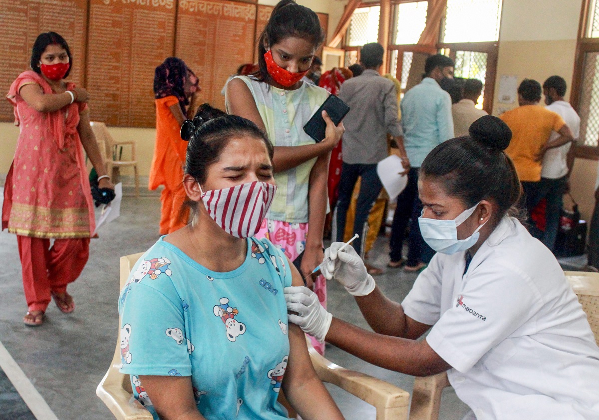 Gurugram: A health worker administers a dose of Covid-19 vaccine to a beneficiary, at a vaccination camp