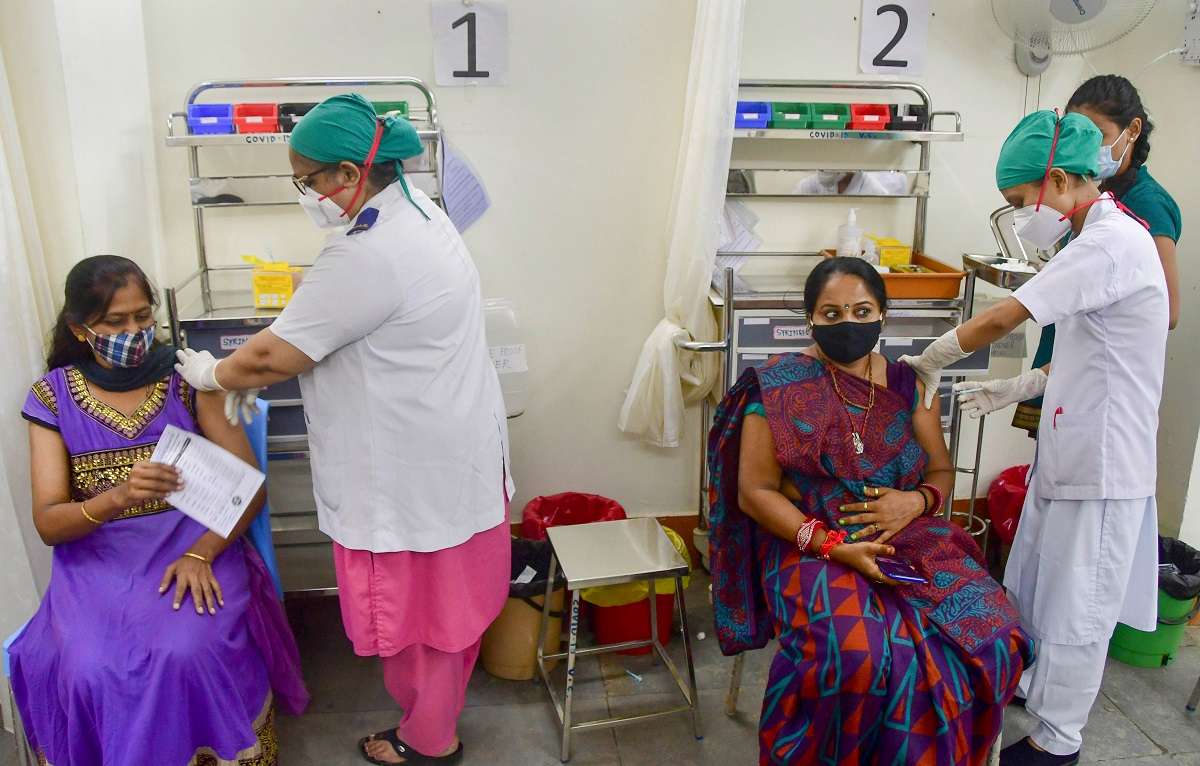 Mumbai: Health workers inoculate beneficiaries against Covid-19, at a vaccination centre of Nair hospital in Mumbai, Monday, August 23, 2021.&nbsp;