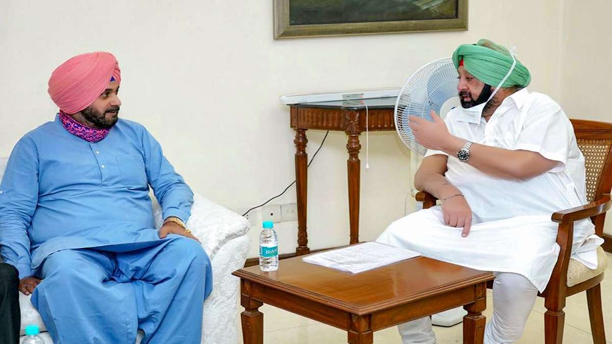 Punjab Congress chief Navjot Singh Sidhu with CM Amarinder Singh.