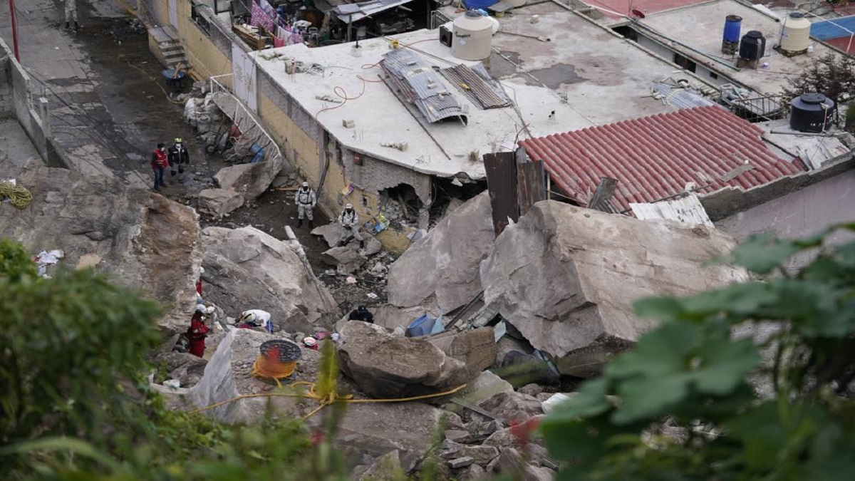 Firefighters scale a 3-story pile of rocks in Tlalnepantla, on outskirts of Mexico City.
&nbsp;