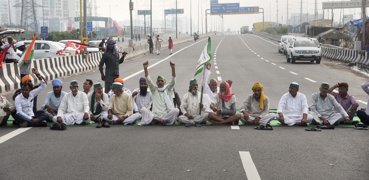 New Delhi: Farmers block a road during their Bharat Bandh, at Ghazipur border