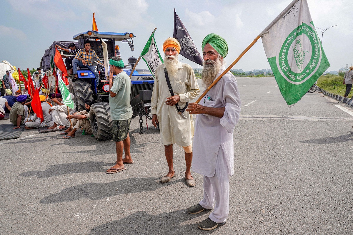 Sonipat: Farmers shout slogans as they block an expressway as part of protests against farm reforms during Bharat Bandh protests, at KMP Expressway