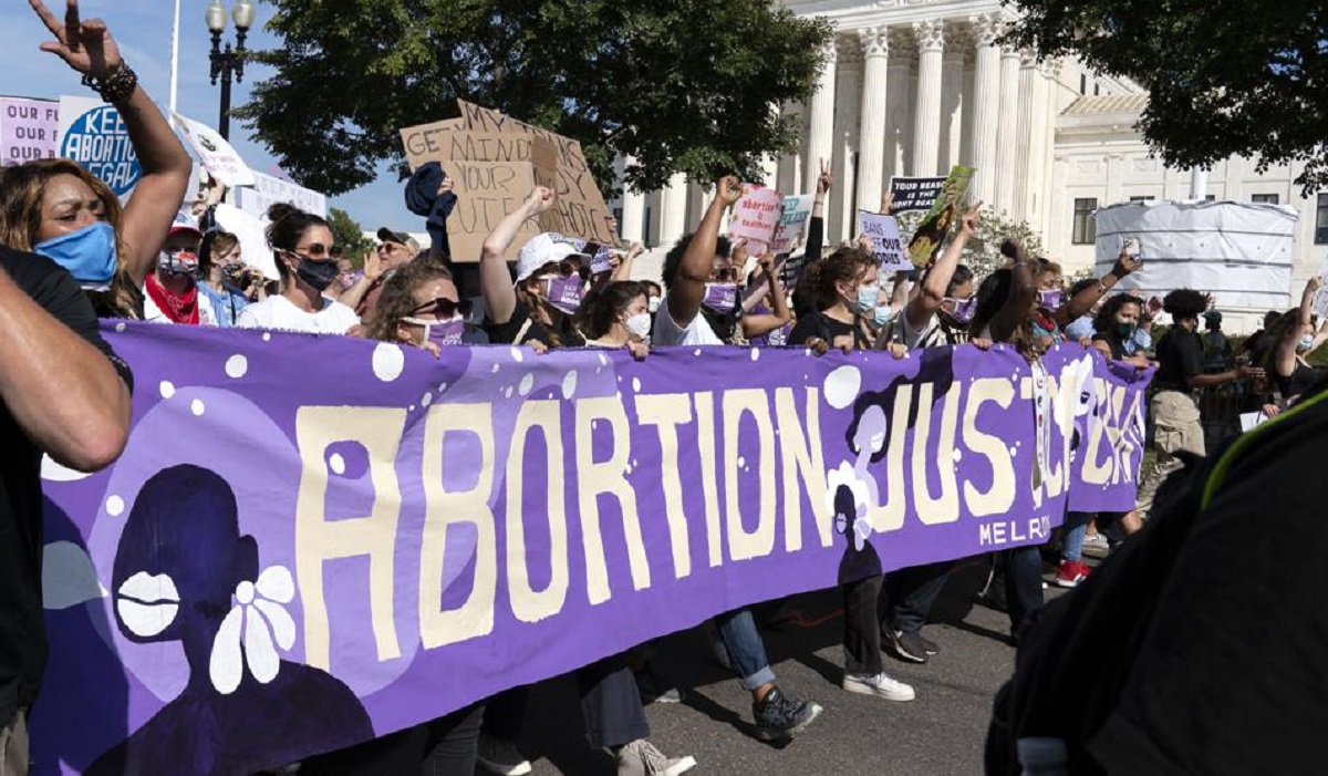 Thousands of demonstrators march outside the U.S. Supreme Court during the Women's March in Washington