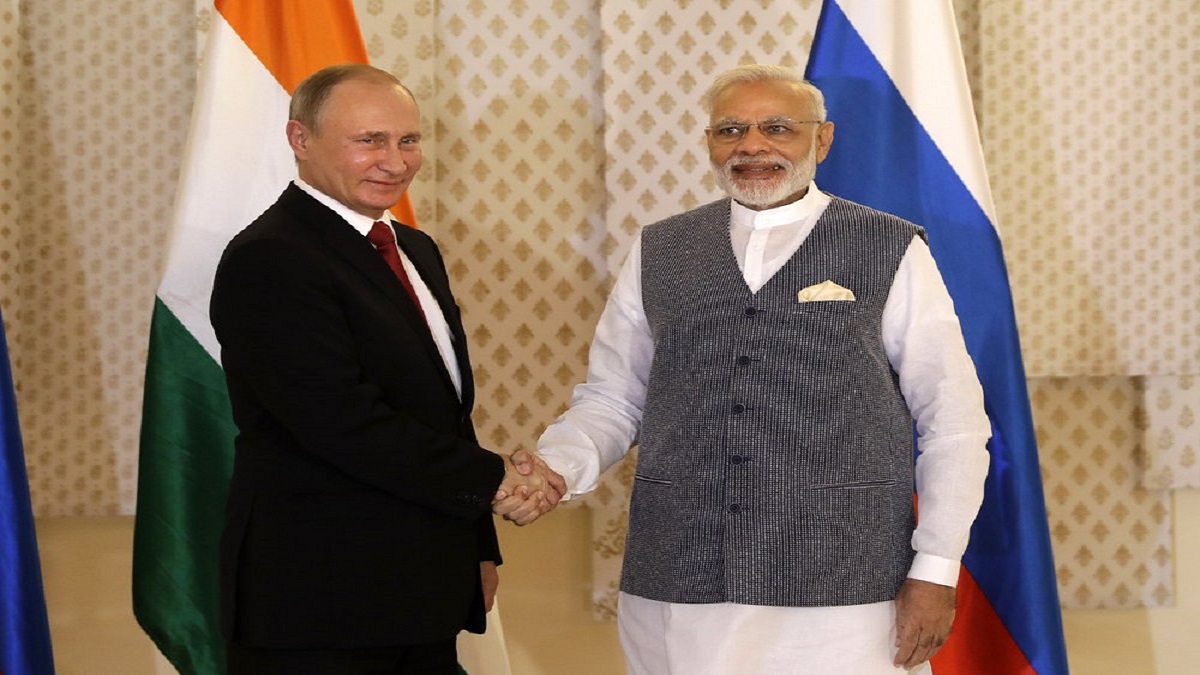 Indian Prime Minister Narendra Modi, right, shakes hand with Russian President Vladimir Putin.
