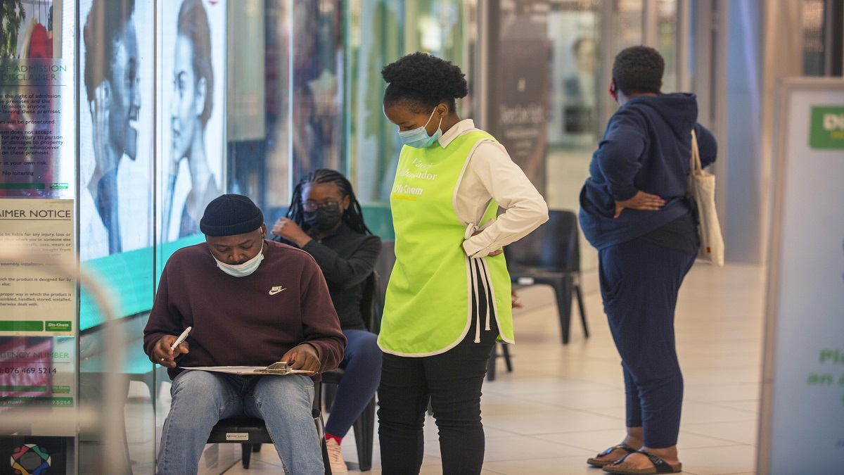 People wait to get vaccinated at a shopping mall, in Johannesburg, South Africa