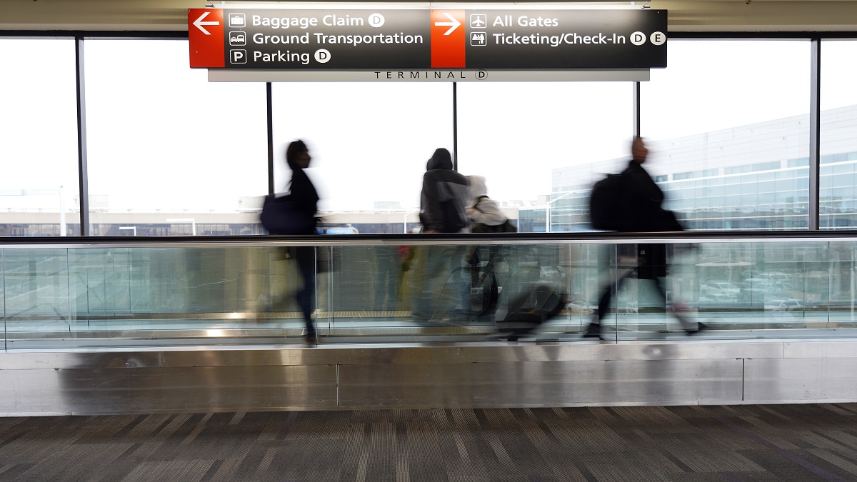 Travelers walk to their gates at the Philadelphia International Airport.