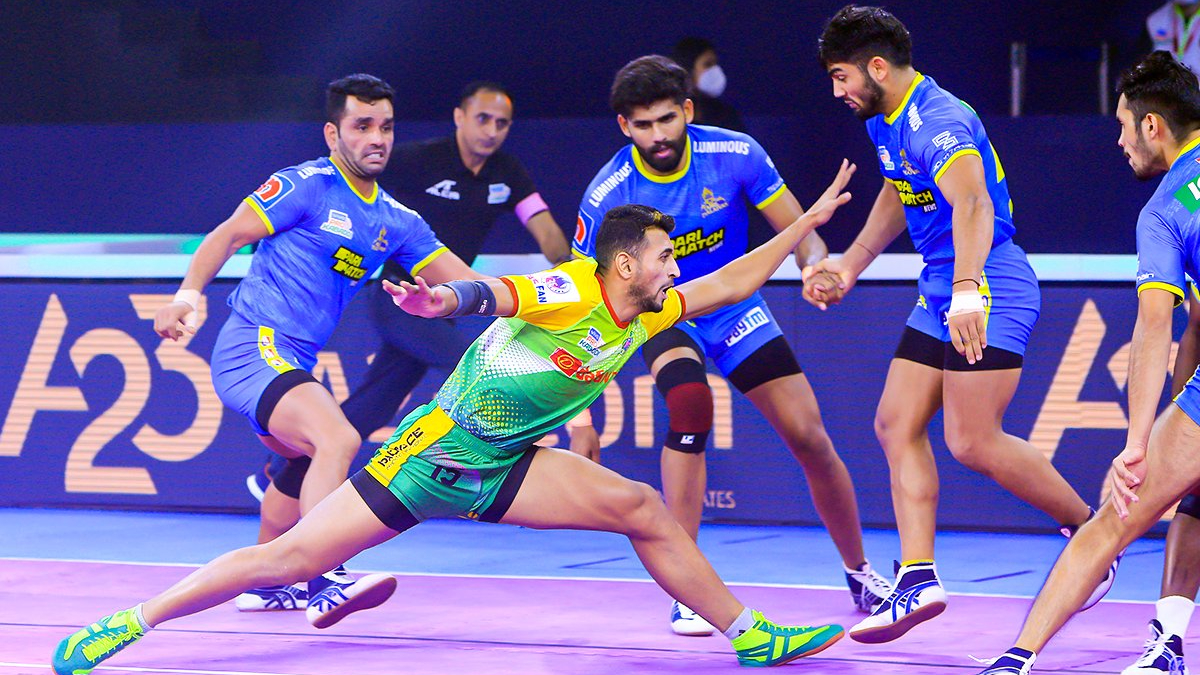 Tamil Thalaivas' K. Prapanjan, in blue and yellow jersey, is pinned down by  players of Patna Pirates during their Vivo Pro Kabaddi league match in  Mumbai, India, Saturday, Aug. 26, 2017. (AP