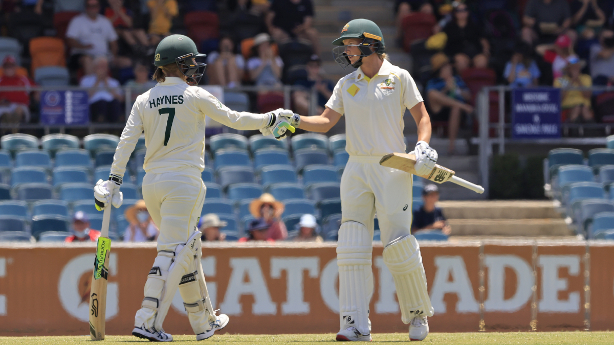 Australia women's Rachael Haynes (left) is congratulated by captain Meg Lanning after reaching her half-century during Day 1 of the Women's Ashes Test at Manuka Oval in Canberra on Thursday.